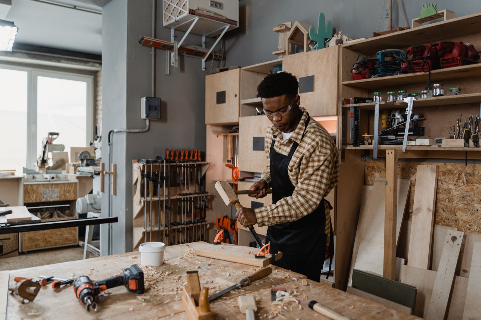 A woodworker busy at the bench in his workshop